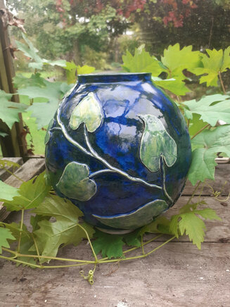 Ceramic pot with leaf decoration