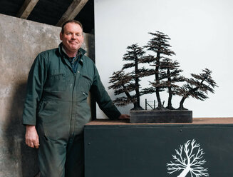 David with one of his welded metal tree creations