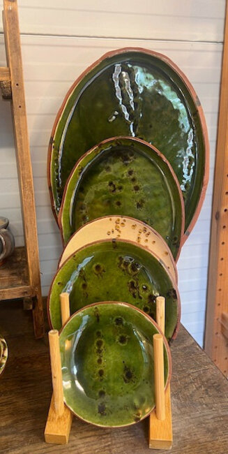 Green and cream earthenware plates