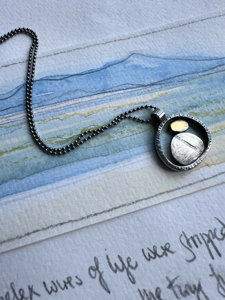 Wee pebble pool necklace. Silver and 24ct gold. North collection