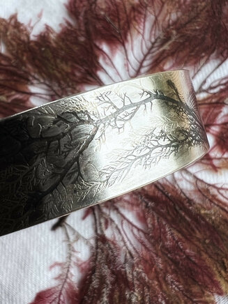 Water's edge wrist cuff. Silver and seaweed impression. North collection