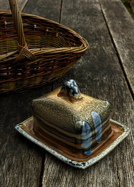 Wood-fired salt-glazed stoneware butterdish by Petra Steward, willow flower basket by Clyde Hoare